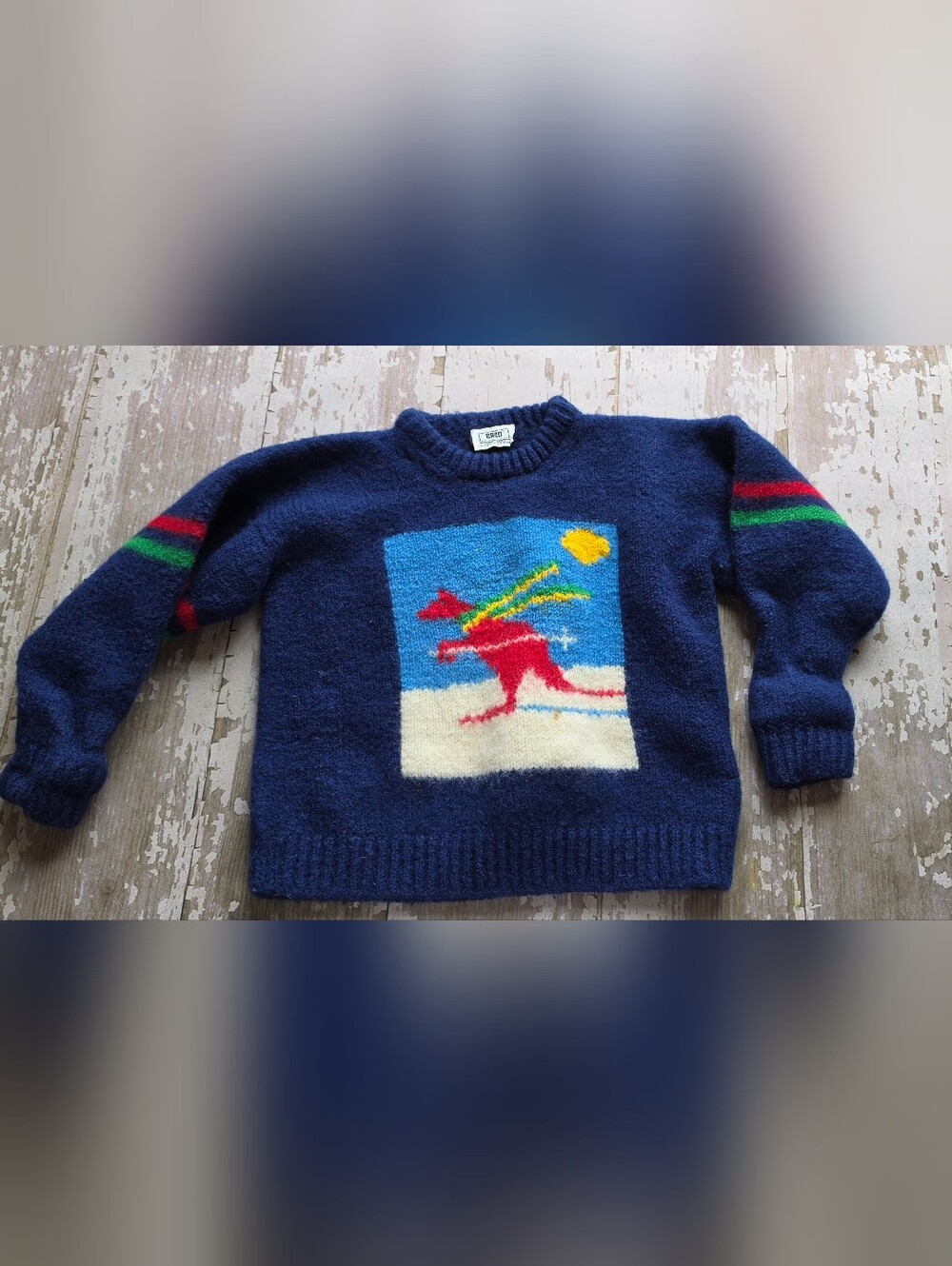 This is a vintage New Zealand-made BABO navy wool sweater With sking Kangaroo.